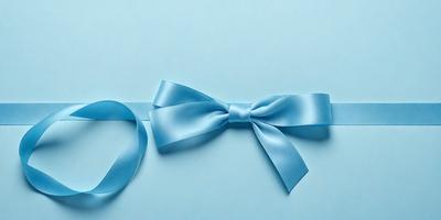 The primary subject of the image is a blue bow, which is prominently displayed on a blue background. The setting appears to be a white surface, possibly a wall or a table. The visual style of the image is a close-up of the bow, emphasizing its details and texture. The colors and mood of the image are predominantly blue, creating a calm and serene atmosphere.