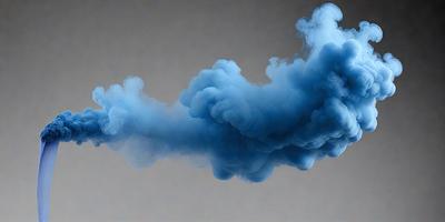 The primary subject of the image is a blue smoke or vapor, which appears to be a part of a larger cloud formation. The setting is a gray background, which contrasts with the blue smoke. The visual style of the image is a close-up of the smoke, emphasizing its texture and movement. The colors and mood of the image are predominantly blue, creating a sense of depth and tranquility.