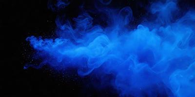 The primary subject of the image is a blue smoke or fog, which appears to be floating in the air. The setting is a dark, starry sky, creating a dramatic and atmospheric backdrop. The visual style of the image is a combination of photo and digital art, as it captures the smoke's movement and the starry sky's depth. The colors and mood of the image are predominantly blue, with the smoke and sky creating a serene and mysterious atmosphere.