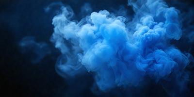 The primary subject of the image is a blue cloud, which is the main object, scene, or focus of the image. The setting or background is a dark blue sky, and the visual style appears to be a photo. The dominant colors in the image are blue and black, creating a moody atmosphere.