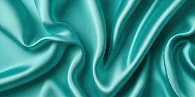 The primary subject of the image is a close-up of a piece of blue fabric, possibly a piece of silk. The setting is a blue background, which complements the blue fabric. The visual style appears to be a photo, as the fabric is captured in detail. The colors and mood of the image are predominantly blue, creating a calm and serene atmosphere.