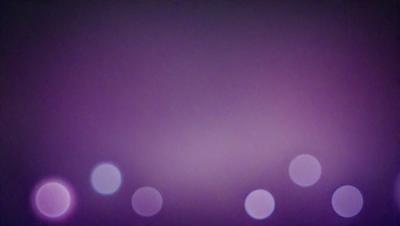 The primary subject of the image is a purple background with a pattern of white dots. The setting appears to be a dark room, and the visual style is a combination of a photo and digital art. The dominant colors are purple and white, creating a moody and atmospheric scene.