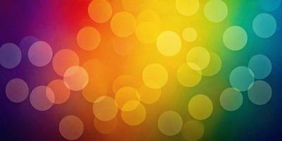 The primary subject of the image is a colorful pattern of circles, which are arranged in a visually appealing manner. The setting is a colorful background, possibly a wall or a piece of artwork, that complements the vibrant circles. The visual style of the image is a combination of photo and digital art, creating a unique and eye-catching design. The dominant colors in the image are yellow, orange, and green, which contribute to a lively and cheerful atmosphere.