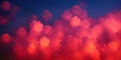 The primary subject of the image is a cloudy sky with pink clouds. The setting is a sunset, creating a warm and serene atmosphere. The visual style is a photo, capturing the beauty of the pink clouds against the backdrop of the sky. The colors and mood of the image are predominantly pink, with the clouds creating a sense of tranquility and natural beauty.