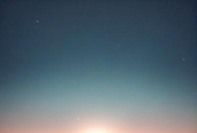 The primary subject of the image is the night sky, which is filled with stars and a bright moon. The setting is a dark, cloudless night, with the moon and stars shining brightly against the black background. The visual style is a natural, outdoor scene, with no indication of digital art or illustration. The colors and mood of the image are predominantly dark and serene, with the bright moon and stars providing a contrasting glow.