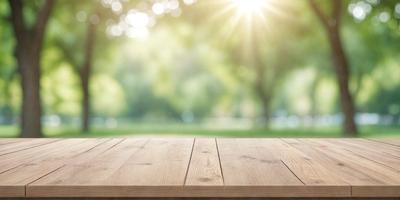 The primary subject of the image is a wooden deck or platform. The setting is a grassy area with trees in the background, creating a serene and natural atmosphere. The visual style is a photo, capturing the outdoor environment and the wooden deck. The colors and mood are predominantly green, with the grass and trees, and the wooden deck adding warmth to the scene.