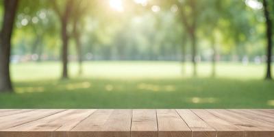 The primary subject of the image is a wooden bench, which is placed in a grassy field. The setting is a park with trees in the background. The visual style is a photo, capturing the natural environment and the wooden bench. The colors and mood of the image are predominantly green, with the grass and trees creating a serene and peaceful atmosphere.