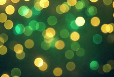 The primary subject of the image is a brightly lit green background with a pattern of yellow and green lights. The setting appears to be a dark room, and the visual style is a combination of a photo and digital art. The dominant colors are green and yellow, creating a lively and energetic atmosphere.