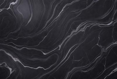 The primary subject of the image is a close-up of a marble countertop. The setting is a kitchen, with the countertop being the main focus of the scene. The visual style is a black and white photo, which adds a classic and timeless feel to the image. The dominant colors are black and white, creating a stark and elegant atmosphere.