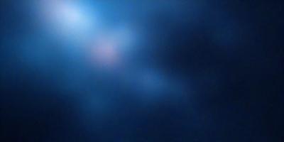 The primary subject of the image is a blue sky with a few clouds. The setting is a dark blue background, which contrasts with the lighter blue of the sky. The visual style is a photo, capturing the beauty of the cloudy sky. The colors and mood of the image are serene and peaceful, with the dark blue background adding a sense of depth and mystery to the scene.