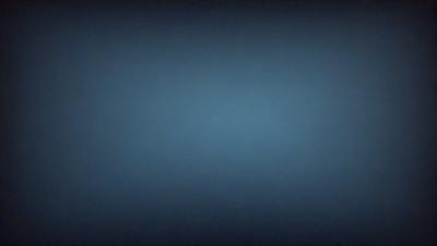 The primary subject of the image is a blue background. The setting is a dark, empty space with no visible objects or people. The visual style is a simple, monochromatic design. The colors and mood are predominantly dark and moody, with the blue background creating a sense of depth and mystery.