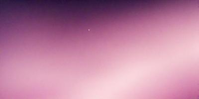 The primary subject of the image is a single star in the sky. The setting is a pink sky, which creates a unique and visually striking backdrop. The visual style of the image is a photo, capturing the star and its surroundings. The colors and mood of the image are predominantly pink, giving it a warm and serene atmosphere.
