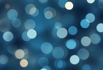 The primary subject of the image is a blue background with a pattern of white lights. The setting appears to be a nighttime sky, with the lights creating a visually appealing and serene atmosphere. The visual style of the image is a combination of a photo and digital art, as it captures the beauty of the night sky with the white lights. The colors and mood of the image are predominantly blue and white, creating a sense of calmness and tranquility.