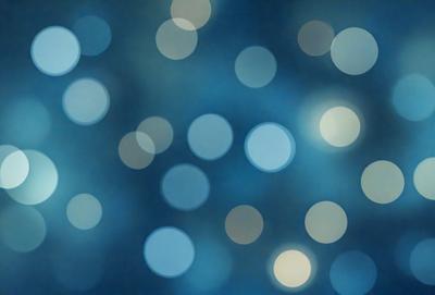 The primary subject of the image is a blue background with a pattern of white lights. The setting appears to be a nighttime sky, creating a serene and peaceful atmosphere. The visual style of the image is a combination of a photo and digital art, as it captures the beauty of the night sky with the white lights. The colors and mood of the image are predominantly blue and white, giving it a calming and tranquil feel.
