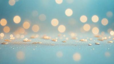 The primary subject of the image is a close-up of a blue background with a pattern of gold glittering stars. The setting is a dark blue surface, and the visual style appears to be a digital art or illustration. The dominant colors are blue and gold, creating a calm and serene atmosphere.