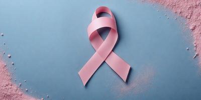 The primary subject of the image is a pink ribbon, which is the main focus of the scene. The ribbon is displayed on a blue surface, creating a visually appealing contrast between the two colors. The image appears to be a digital art or illustration, showcasing the ribbon in a creative and eye-catching manner. The overall atmosphere of the image is positive and uplifting, as the pink ribbon is often associated with breast cancer awareness and support.
