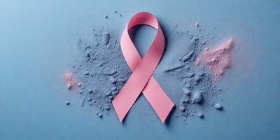 The primary subject of the image is a pink ribbon, which is the main focus of the scene. The ribbon is placed on a blue surface, creating a visually striking contrast between the pink and blue colors. The image appears to be a digital art or illustration, as it is not a photo or a clipart. The overall atmosphere of the image is positive and uplifting, as the pink ribbon symbolizes support and solidarity for those affected by breast cancer.