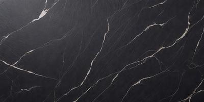 The primary subject of the image is a black marble countertop. The setting is a kitchen, with the countertop being the main focus of the scene. The visual style is a close-up of the marble countertop, showcasing its texture and pattern. The colors and mood of the image are dark and moody, with the black marble countertop being the dominant color.