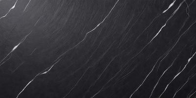 The primary subject of the image is a black marble countertop. The setting is a kitchen, with the countertop being the main focus of the scene. The visual style is a close-up of the marble countertop, showcasing its texture and pattern. The colors and mood of the image are predominantly dark, with the black marble countertop being the main source of contrast.