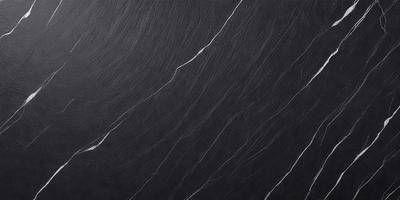 The primary subject of the image is a black and white photograph of a marble countertop. The setting is a kitchen, with the marble countertop being the main focus of the scene. The visual style is a close-up of the marble countertop, showcasing its texture and pattern. The colors and mood of the image are predominantly black and white, giving it a classic and elegant appearance.