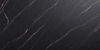 The primary subject of the image is a close-up of a black leather surface. The setting is a black background, which creates a striking contrast with the leather. The visual style is a photo, showcasing the leather's texture and details. The colors in the image are predominantly black, giving it a sleek and modern appearance.