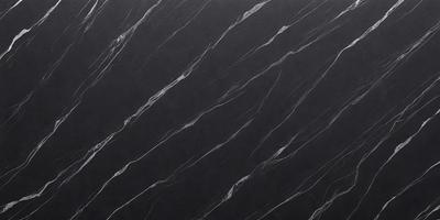 The primary subject of the image is a black marble countertop. The setting is a kitchen, with the countertop being the main focus of the scene. The visual style is a close-up of the marble countertop, showcasing its texture and pattern. The colors and mood of the image are dark and moody, with the black marble countertop being the dominant color.