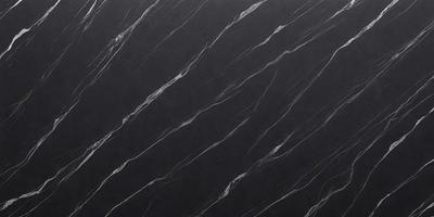 The primary subject of the image is a black marble countertop. The setting is a kitchen, with the countertop being the main focus of the scene. The visual style is a close-up of the marble countertop, showcasing its texture and pattern. The colors and mood of the image are dark and moody, with the black marble countertop being the dominant color.