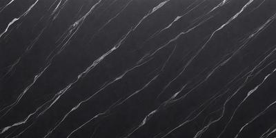 The primary subject of the image is a black marble countertop. The setting is a kitchen, with the countertop being the main focus of the scene. The visual style is a close-up of the marble countertop, showcasing its texture and pattern. The colors and mood of the image are dark and moody, with the black marble countertop being the dominant color.