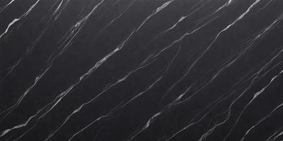 The primary subject of the image is a black marble countertop. The setting is a kitchen, with the countertop being the main focus of the scene. The visual style is a close-up of the marble countertop, showcasing its texture and pattern. The colors and mood of the image are predominantly dark, with the black marble countertop being the main source of contrast.