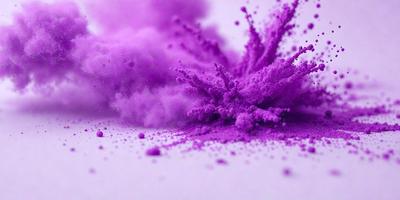 Purple powder is the primary subject of the image. The setting is a white surface, which provides a clean and contrasting background. The visual style is a close-up of the purple powder, showcasing its texture and color. The colors and mood of the image are predominantly purple, creating a vibrant and lively atmosphere.