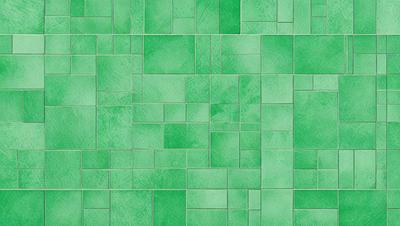The primary subject of the image is a green tile wall. The setting is a room with a green tile floor. The visual style is a close-up of the green tile wall, showcasing the intricate pattern and texture. The dominant colors are green, and the overall atmosphere is clean and fresh.