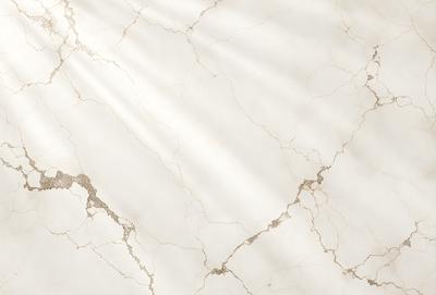 The primary subject of the image is a marble wall with a sunlight shining on it. The setting is a room with a white marble wall, and the visual style is a photo. The colors and mood of the image are predominantly white, giving it a clean and elegant appearance.