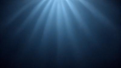 The primary subject of the image is a bright light source, possibly a sun or a light bulb, shining through a blue sky. The setting is a dark, starry night, with the light source illuminating the sky and creating a dramatic contrast. The visual style is a combination of a photo and a digital art, as the light source appears to be a digital creation, while the night sky and the overall atmosphere are reminiscent of a natural scene. The colors and mood of the image are predominantly dark