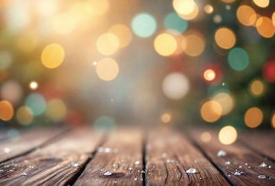 The primary subject of the image is a wooden floor with a pattern of lights on it. The setting is a room with a Christmas tree in the background. The visual style is a photo, and the colors and mood are festive and warm, with the lights creating a cozy atmosphere.