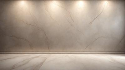The primary subject of the image is a marble wall with a patterned texture. The setting is a room with a white floor, and the visual style is a photo. The colors and mood of the image are predominantly white, giving it a clean and minimalist appearance.