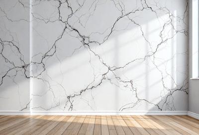 The primary subject of the image is a white marble wall with a pattern of holes in it. The setting is a room with a wooden floor, and the visual style is a photo. The dominant colors are white and gray, creating a clean and minimalist atmosphere.