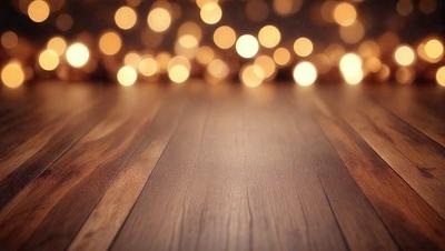 The primary subject of the image is a wooden floor with a pattern of lights on it. The setting is a room with a wooden floor, and the visual style is a photo. The dominant colors are brown and white, and the overall atmosphere is warm and inviting.