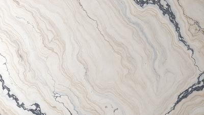 The image features a marble countertop with a unique, swirling pattern. The countertop appears to be white, and the pattern adds a touch of elegance and sophistication to the space. The overall atmosphere of the image is clean and modern, with the marble countertop serving as a focal point in the scene.