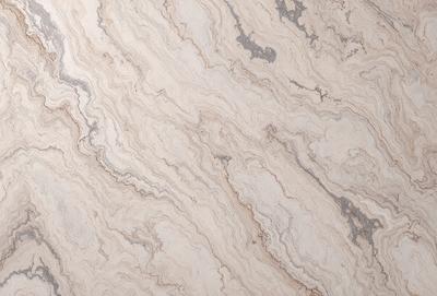 The primary subject of the image is a marble countertop with a unique, swirled pattern. The setting is a kitchen or bathroom, as the countertop is a part of the design. The visual style is a close-up of the marble countertop, showcasing its intricate pattern. The colors and mood of the image are predominantly neutral, with the marble countertop being the main focus.