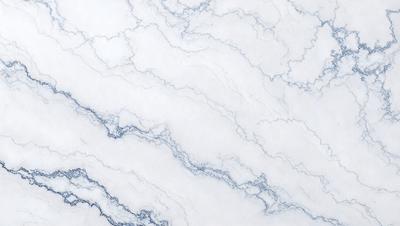 The primary subject of the image is a marble surface with a white and blue color scheme. The setting is a white marble wall, and the visual style is a close-up of the marble surface. The colors and mood of the image are predominantly white and blue, creating a clean and elegant atmosphere.