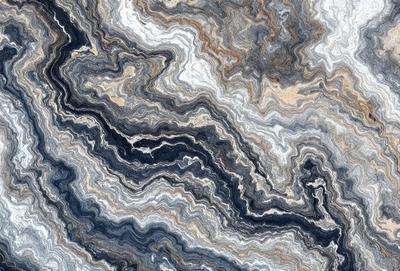 The primary subject of the image is a close-up of a marble-like stone with a unique and intricate pattern. The setting is a natural environment, possibly a rock formation or a stone wall. The visual style is a close-up of the stone, showcasing its texture and details. The colors and mood of the image are predominantly earthy tones, giving it a natural and organic feel.