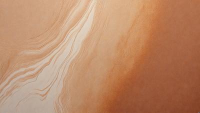 The primary subject of the image is a close-up of a marbled wall, showcasing its unique texture and pattern. The setting is a room with a brown color scheme, which complements the marbled wall. The visual style is a close-up of the wall, emphasizing its intricate details. The colors and mood of the image are warm and inviting, with the brown tones creating a cozy atmosphere.
