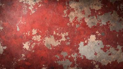 The primary subject of the image is a red and brown wall with a pattern of red and white spots. The setting is a room with a red and brown wallpaper. The visual style is a close-up of the wallpaper, showcasing the intricate pattern. The dominant colors are red and brown, creating a warm and inviting atmosphere.