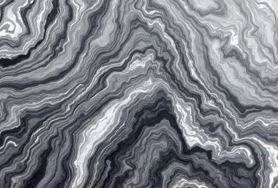 The primary subject of the image is a close-up of a rocky surface, possibly a stone or marble wall. The setting is a natural environment, with the rocky surface being the main focus of the image. The visual style appears to be a close-up of the rocky surface, possibly a photo or a digital art piece. The colors and mood of the image are predominantly dark and moody, with the rocky surface being the main visual element.