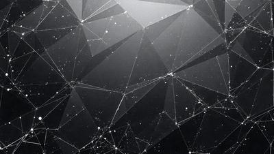The primary subject of the image is a black and white pattern of triangles, which creates a visually striking and intricate design. The setting is a dark background, which contrasts with the pattern and adds depth to the image. The visual style is a combination of digital art and illustration, as the triangles are arranged in a way that resembles a celestial pattern. The colors and mood of the image are predominantly black and white, giving it a timeless and elegant appearance.