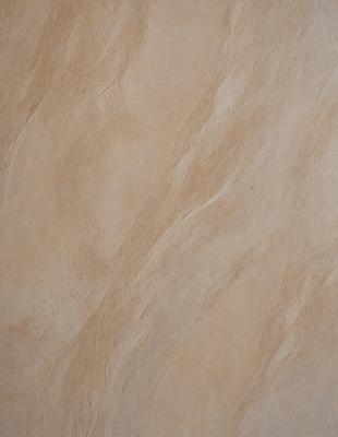 The primary subject of the image is a close-up of a brown and white marble wall. The setting is a room with a marble wall, and the visual style is a photo. The dominant colors are brown and white, creating a warm and natural atmosphere.