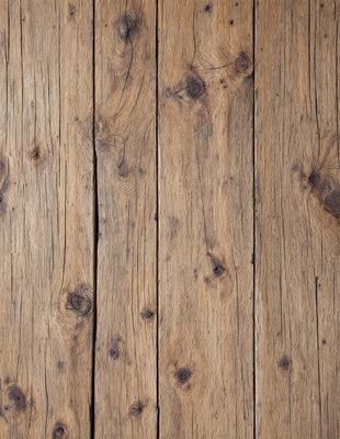 The primary subject of the image is a wooden floor with a unique and rustic appearance. The setting is a room with a wooden floor, and the visual style is a close-up of the wooden surface. The colors and mood of the image are warm and natural, with the wooden floor being the main focus.