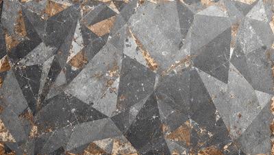 The primary subject of the image is a patterned floor, which features a combination of brown and grey colors. The setting is a room with a stone-like surface, giving the impression of a stone floor. The visual style of the image is a close-up of the floor, showcasing the intricate pattern and texture. The colors and mood of the image are warm and earthy, creating a cozy and inviting atmosphere.