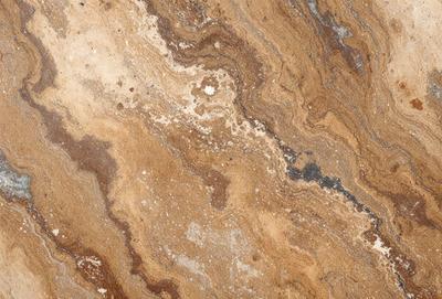 The primary subject of the image is a marble-like surface with a brown and tan color palette. The setting is a stone-like surface, possibly a marble countertop or a similar material. The visual style of the image is a close-up of the marble-like surface, showcasing its texture and patterns. The colors and mood of the image are warm and earthy, giving it a natural and luxurious appearance.