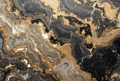 The primary subject of the image is a close-up of a marble surface with a gold and black pattern. The setting is a black and gold marble wall, which serves as the background. The visual style is a close-up of the marble surface, showcasing the intricate pattern and texture. The colors and mood of the image are predominantly black and gold, creating a luxurious and elegant atmosphere.